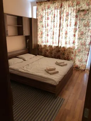 a bedroom with a bed with two towels on it at Apartmán Katka, Obzor in Obzor