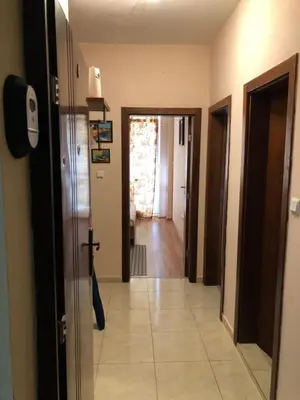 a hallway of a house with a door open at Apartmán Katka, Obzor in Obzor