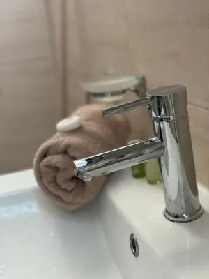 a sink with a stuffed animal sitting on top of it at Villa Rada, Bay View Villas in Kosharitsa