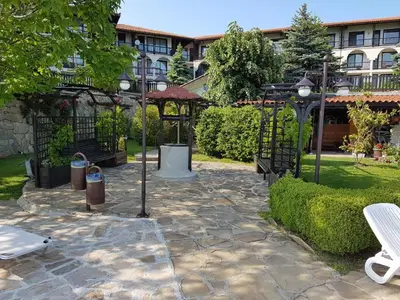 a garden with a gazebo in a park at Monastery Apartment 14, St. Vlas in Sveti Vlas