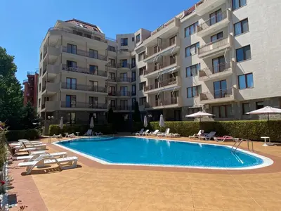 a swimming pool in front of a building at SUMMER BREEZE 110 Cozi Studio in Sunny Beach