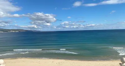 a view of the ocean from a beach at Penthouse Happy Moments 2 in Sunny Beach