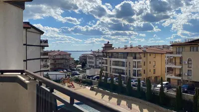 a view from a balcony of a city with buildings at Royal Palm Studio with Seaview in Sveti Vlas