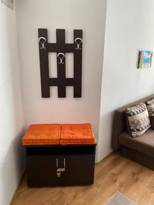 a storage box with an orange seat in a room at Royal Palm Studio with Seaview in Sveti Vlas