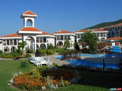 a large building with a pool and a resort at Kambani Arnel Apartment , Marina in Sveti Vlas