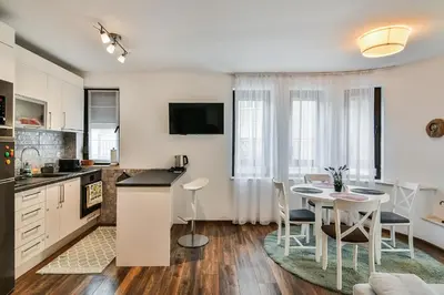a kitchen and dining room with a table and chairs at Varna beach flat 1 in Varna City