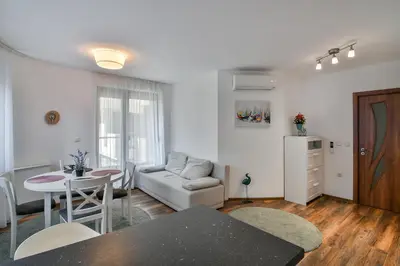 a living room with a couch and a table at Varna beach flat 1 in Varna City