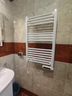 a bathroom with a towel rack on the wall at Apartment Ferienunterkunft Strandnähe mit Pools in Sunny Beach