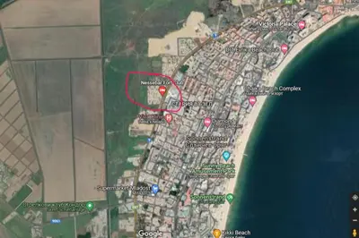a map of a beach with a red circle at Apartment Ferienunterkunft Strandnähe mit Pools in Sunny Beach