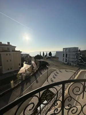 a view of a city street from a balcony at Cosy apartments with sea view in complex PANORAMA in Chernomorets