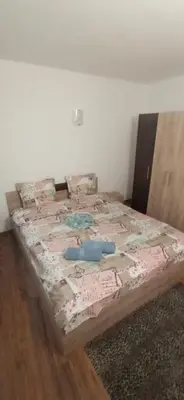 a bed sitting on the floor in a room at Апартамент с две спални. in Varna City