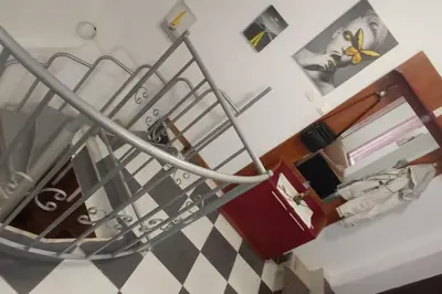 a view of a room with a stair railing and a room with a room at Апартамент с две спални. in Varna City