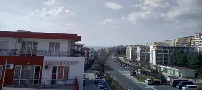 a view of a city street with buildings and cars at Apartament Panorama - BastetBS in Sveti Vlas