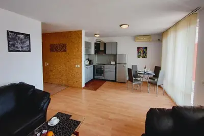 a living room with a couch and a table at Apartament Panorama - BastetBS in Sveti Vlas