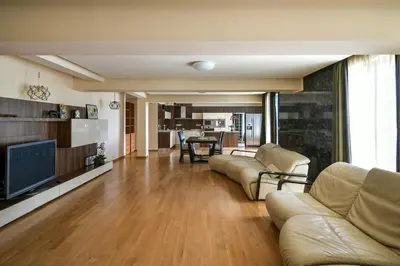 a living room with a couch and a television at Central flat with Monster living room in Varna City