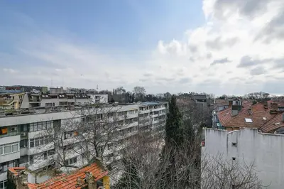 a view of a city with buildings and trees at Budget central next to sea garden and beach in Varna City