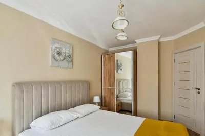 a bedroom with a bed and a mirror at Top location flats in Varna in Varna City