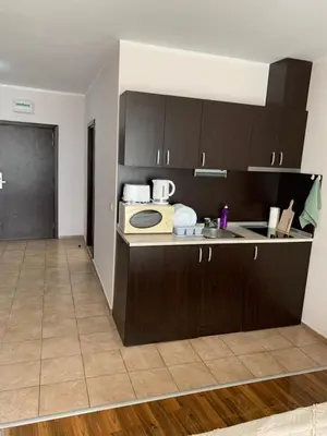 a kitchen with a sink and a counter with a microwave at Студио Нели- Созополистайл Клуб in Sozopol