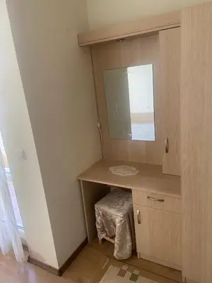 a bathroom with a sink and a mirror at Pomorie Apartment in Pomorie
