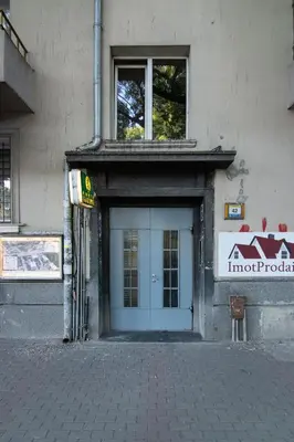 a building with a door with a sign on it at Cozy central flat in Varna Downtown in Varna City