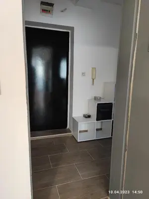 a hallway with a door leading to a kitchen at Royal Apartments Varna in Varna City