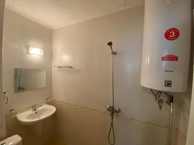 a bathroom with a toilet and a sink and a shower at VIOLET GARDEN 2 Veranda Apartment in Sunny Beach