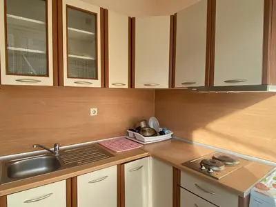 a kitchen with white cabinets and a sink at BALKAN BREEZE 15 Apartment in Sunny Beach
