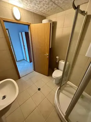 a bathroom with a shower and a toilet and a sink at Large apartment in Sunny Beach in Sunny Beach
