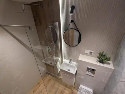 a bathroom with a toilet and a sink and a shower at Sunny place in Sveti Vlas