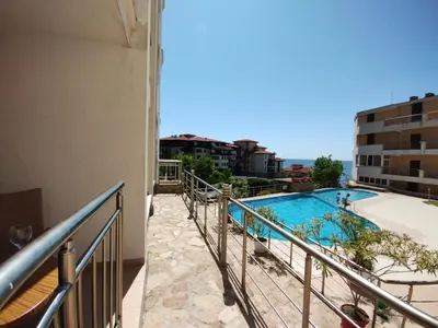 a swimming pool on the balcony of a building at Sunny place in Sveti Vlas