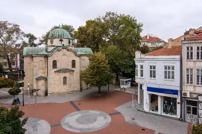 an old building with a green dome on top of it at Top location in center and paid parking in Varna City