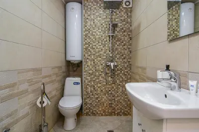 a bathroom with a toilet and a sink at Budget studio in Varna center unde roof in Varna City
