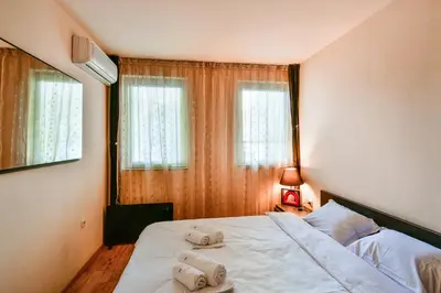 a bedroom with a bed with two towels on it at Budget 1BR flat downtown Varna in Varna City
