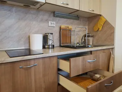 a kitchen with a sink and a counter top at Апартамент Orange в местност Каваци, Созопол in Sozopol