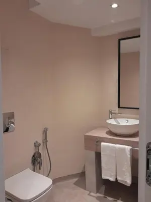 a bathroom with a sink and a toilet and a mirror at Hotel Zenith in Sunny Beach