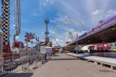 an amusement park with a ferris wheel in the background at Studio Porto in Varna City