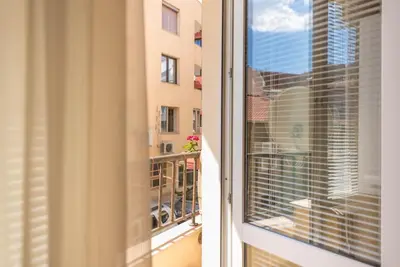 a balcony with a view of a building at Studio Porto in Varna City