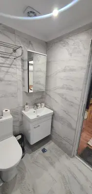 a bathroom with a toilet and a sink at KALI GUEST ROOM in Varna City