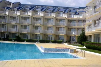 a building with a swimming pool in front of a building at 1 Bed Apt, Close To Ravda Beach in Ravda