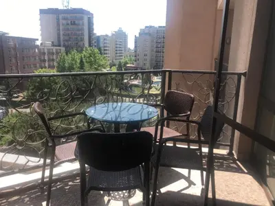 a balcony with chairs and a table on a balcony at 2 Bed, Royal Beach Barcelo Hotel in Sunny Beach