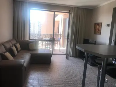 a living room with a couch and a table at 2 Bed, Royal Beach Barcelo Hotel in Sunny Beach