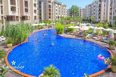 a large swimming pool in a resort with people in it at Luxurious Studio Apt,4* Cascadas in Sunny Beach