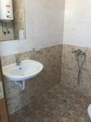 a bathroom with a sink and a shower at Snug Studio Apt, Sunny Day 6 in Tŭnkovo