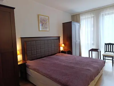 a bedroom with a large bed in a room at Reina Apart Barcelo Beach in Sunny Beach