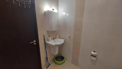 a bathroom with a sink and a toilet and a mirror at Nereya Studio in Pomorie