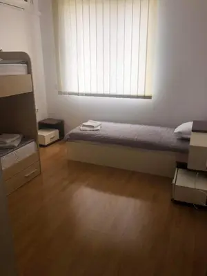 a small bedroom with a bed and a window at Spacious, 2 Bed Apt, Fort Orchid in Sunny Beach