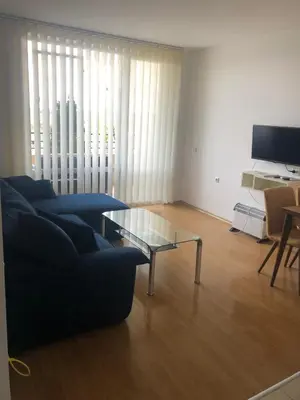 a living room with a couch and a glass table at Spacious, 2 Bed Apt, Fort Orchid in Sunny Beach