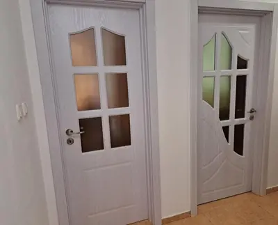 a white door with a mirror in a room at ПРИНЦЕС in Burgas City