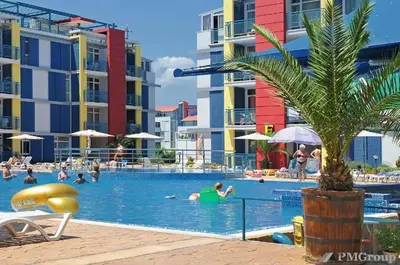 a group of people in the swimming pool at a resort at Комплекс Элит 4 Несебр/Солнечный берег in Sunny Beach