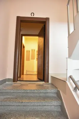 an open door to a hallway in a building at Trimaya apartment - comfort in the top city center in Varna City